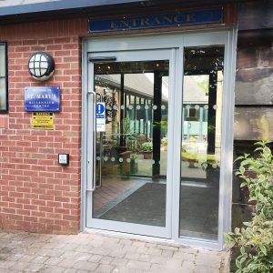 An automatic door system improving accessibility and energy efficiency for a business.