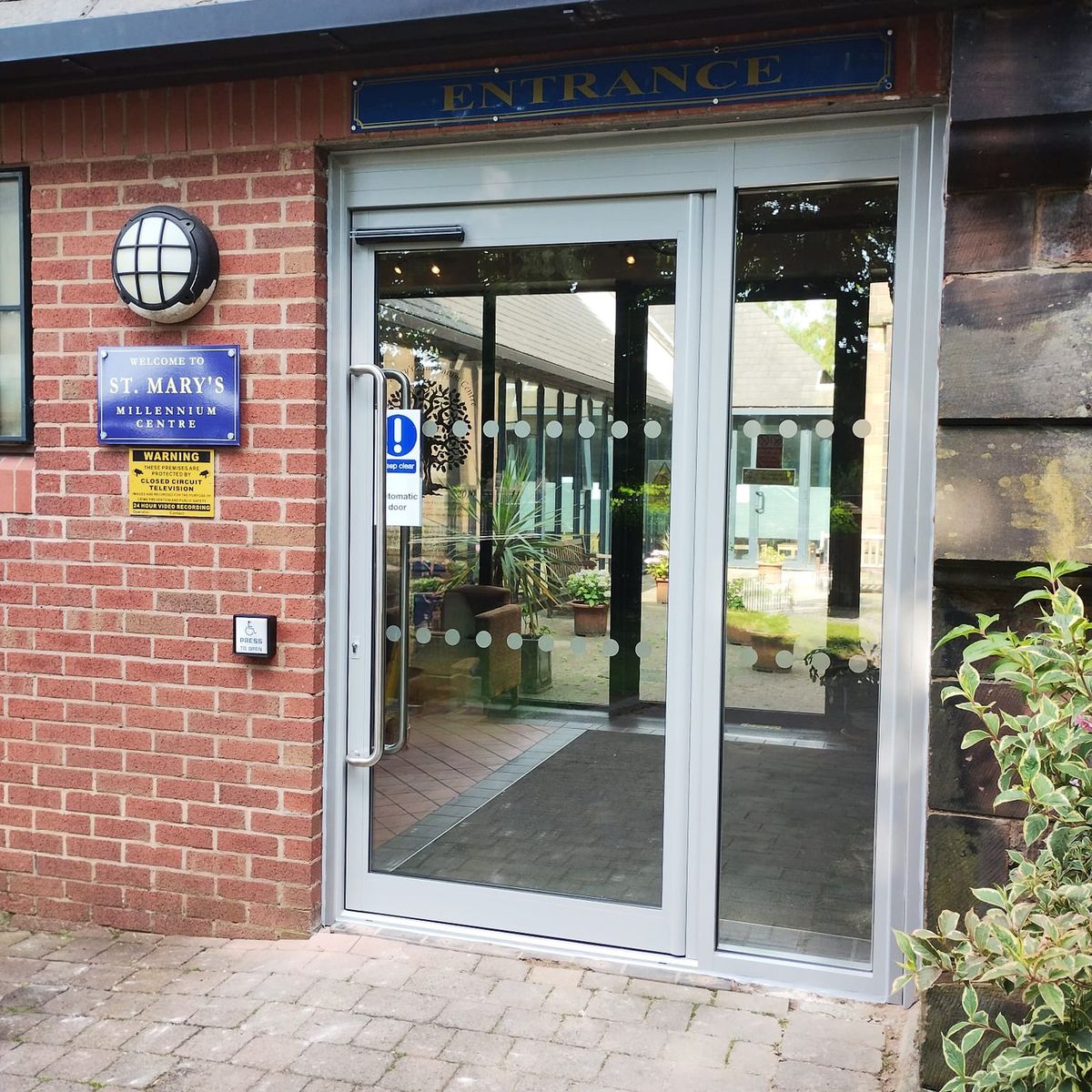 An automatic door system improving accessibility and energy efficiency for a business.