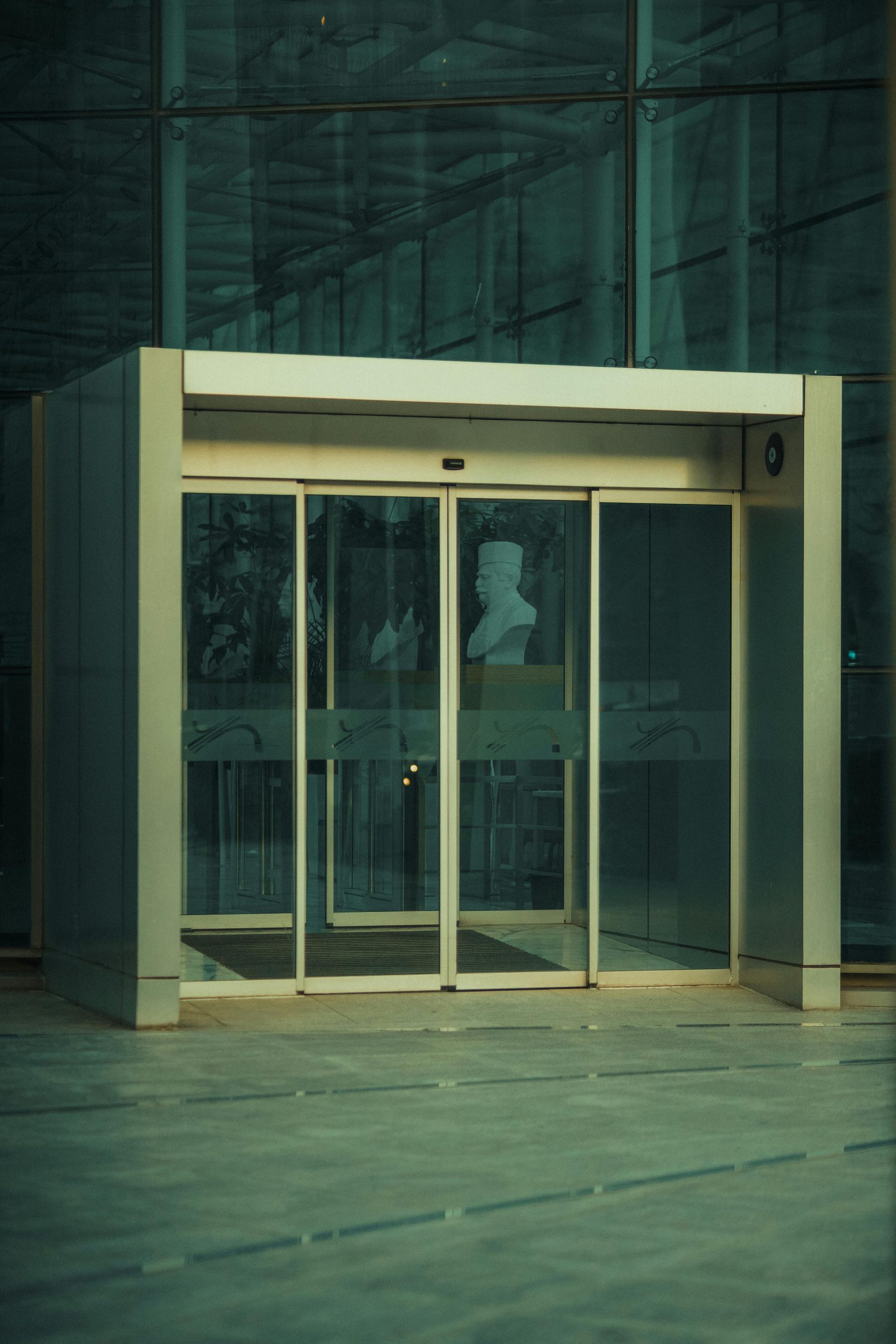 Automatic sliding door opening with no person nearby due to sensor ghosting.
