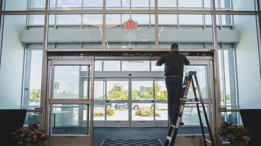 Technician check for automatic swing door faults to prevent sudden failure
